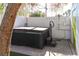 Backyard featuring an in-ground hot tub with access ladder and a white privacy fence and tree at 1403 5Th Pl, Las Vegas, NV 89104
