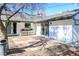 Enclosed backyard with stone patio and white siding at 1403 5Th Pl, Las Vegas, NV 89104