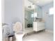 Bright bathroom with modern fixtures, mirrored shower, and sleek double vanity at 1403 5Th Pl, Las Vegas, NV 89104