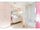 Stylish bathroom featuring a double vanity, modern fixtures, and a separate tub and shower at 1403 5Th Pl, Las Vegas, NV 89104