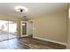 Bedroom with wood-look flooring, neutral walls, and sliding glass door at 1403 5Th Pl, Las Vegas, NV 89104