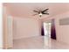 Bedroom featuring tile floors, ceiling fan, closet, and sliding glass door to the outside at 1403 5Th Pl, Las Vegas, NV 89104