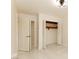 A view of a bedroom with a fan, closets and a view to a hallway at 1403 5Th Pl, Las Vegas, NV 89104
