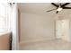 Bedroom with tiled floor, ceiling fan, and a view of the window with sheer curtains at 1403 5Th Pl, Las Vegas, NV 89104