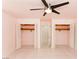 Bedroom with ceiling fan features closet with bifold doors and direct bathroom access at 1403 5Th Pl, Las Vegas, NV 89104