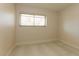 Well-lit bedroom with window and tile flooring at 1403 5Th Pl, Las Vegas, NV 89104
