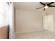 Open bedroom with ceiling fan, window, closet, and door at 1403 5Th Pl, Las Vegas, NV 89104