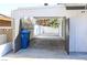 A long carport for covered parking leading to the back of the home at 1403 5Th Pl, Las Vegas, NV 89104