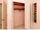 Bedroom closet with built-in shelves and louvered doors at 1403 5Th Pl, Las Vegas, NV 89104