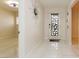 Bright entryway features sleek tile flooring, statement mirror, and modern front door at 1403 5Th Pl, Las Vegas, NV 89104