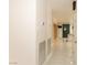 Hallway with sleek tile floors, recessed lighting, and access to multiple rooms at 1403 5Th Pl, Las Vegas, NV 89104