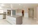 Spacious kitchen featuring a large center island with quartz countertop and stainless steel appliances at 1403 5Th Pl, Las Vegas, NV 89104