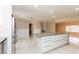 Spacious kitchen featuring a large center island with quartz countertop and modern appliances at 1403 5Th Pl, Las Vegas, NV 89104