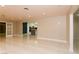 Spacious living room with tiled floors, recessed lighting, and access to the modern kitchen at 1403 5Th Pl, Las Vegas, NV 89104