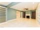Bright living room with fireplace, built-in shelving, and tile floors at 1403 5Th Pl, Las Vegas, NV 89104