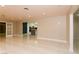 Bright living room features sleek tile flooring and recessed lighting for a modern aesthetic at 1403 5Th Pl, Las Vegas, NV 89104
