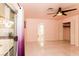 Serene main bedroom with tile floors, a ceiling fan, and access to the backyard through sliding glass doors at 1403 5Th Pl, Las Vegas, NV 89104