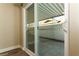 View of the patio with a privacy wall, covered area, and smooth concrete flooring through the glass door at 1403 5Th Pl, Las Vegas, NV 89104