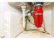 A view of the plumbing under the kitchen sink, including a garbage disposal at 1403 5Th Pl, Las Vegas, NV 89104