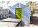 View of the backyard storage shed, adjacent to the hot tub and outdoor shower feature at 1403 5Th Pl, Las Vegas, NV 89104