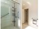 Modern glass walk-in shower with tiled walls and floors and stainless steel fixtures at 1403 5Th Pl, Las Vegas, NV 89104