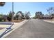 This suburban street features a wide road, sidewalks, and well-maintained landscaping at 1403 5Th Pl, Las Vegas, NV 89104