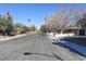 Wide suburban street lined with mature trees and sidewalks, showcasing neighborhood charm at 1403 5Th Pl, Las Vegas, NV 89104