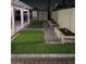 Landscaped backyard with artificial turf and a pergola at 2109 Juana Vista St, Las Vegas, NV 89102