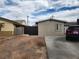 House with a dark brown gate and a paved driveway, offering convenient access at 2109 Juana Vista St, Las Vegas, NV 89102