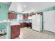 Well-lit kitchen features tile floors, dark cabinets and modern appliances, creating a functional and appealing workspace at 2121 Upland Ave, Pahrump, NV 89048