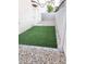 Artificial turf backyard with a stone border at 2132 Fred Brown Dr, Las Vegas, NV 89106