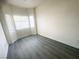 Bright bedroom with large window and grey vinyl flooring at 2132 Fred Brown Dr, Las Vegas, NV 89106