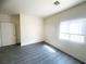 Bright bedroom with gray vinyl flooring and window coverings at 2132 Fred Brown Dr, Las Vegas, NV 89106