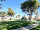 Community green space with trees and walking path at 2132 Fred Brown Dr, Las Vegas, NV 89106