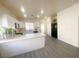 Modern kitchen with white cabinets, island, and gray floors at 2132 Fred Brown Dr, Las Vegas, NV 89106