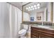 Bathroom with granite vanity, large mirror, and shower/tub combo at 230 E Flamingo Rd # 412, Las Vegas, NV 89169