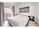 King-size bed, large artwork, and balcony access at 230 E Flamingo Rd # 412, Las Vegas, NV 89169