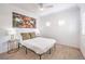 Bright bedroom with a double bed, wood floors, and large artwork at 230 E Flamingo Rd # 412, Las Vegas, NV 89169