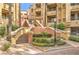 Attractive building exterior with well-maintained landscaping and walkway at 230 E Flamingo Rd # 412, Las Vegas, NV 89169