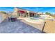 Relaxing backyard with pool, hot tub, patio, and views of the surrounding landscape at 2540 Youngdale Dr, Las Vegas, NV 89134