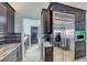 Kitchen featuring stainless steel refrigerator and dark wood cabinetry at 2540 Youngdale Dr, Las Vegas, NV 89134