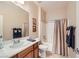 Bathroom featuring a shower-tub combo with tile floors and a single sink at 2608 Dearport Ct, Henderson, NV 89052