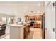 Open kitchen design with stainless steel appliances, a breakfast bar, and a dining area for easy entertaining at 2608 Dearport Ct, Henderson, NV 89052