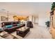 Open-concept living room leading to the kitchen with an island and lots of natural light, perfect for entertaining at 2608 Dearport Ct, Henderson, NV 89052