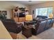 Well-lit living room features a large window and an entertainment center for gatherings and relaxation at 2608 Dearport Ct, Henderson, NV 89052