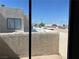 A look out from the balcony to a community rooftop with a view of the city at 2679 Jacyra Ave, Las Vegas, NV 89121