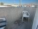 Small balcony with a plastic chair and litter box at 2679 Jacyra Ave, Las Vegas, NV 89121