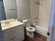 Standard bathroom with white fixtures, including tub/shower and vanity with mirror at 2679 Jacyra Ave, Las Vegas, NV 89121