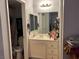 Modest bathroom featuring a single sink vanity and a toilet/shower with white colored finishes at 2679 Jacyra Ave, Las Vegas, NV 89121