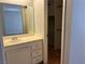 View from bathroom to bedroom with vanity, mirror, and closet at 2679 Jacyra Ave, Las Vegas, NV 89121